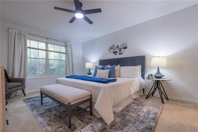 a bedroom with a bed and a window