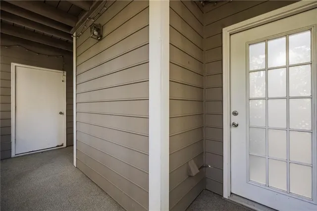 a view of a door and a window