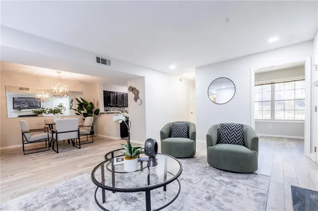 a living room with furniture or couch and a large window