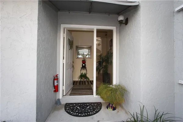 a view of entryway with wooden floor and a potted plant