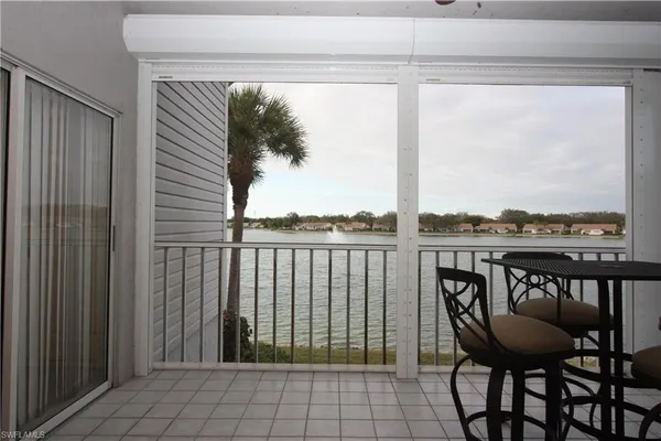 a view of a balcony with furniture