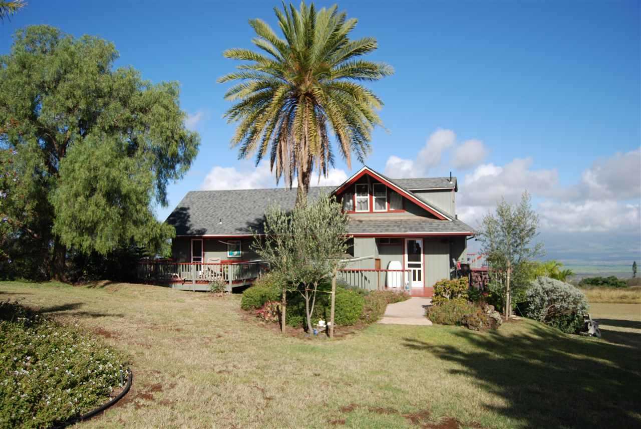 1007 Calasa Road Kula, HI 96790 - Photo 1 of 1 a front view of house with yard and trees around