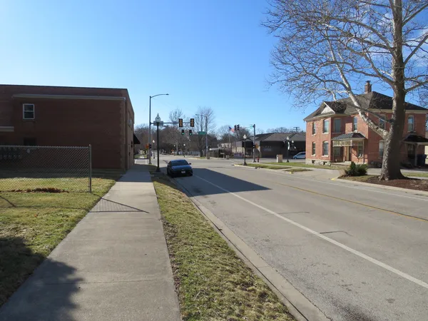 a swimming pool with buildings in the background