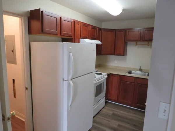 a white refrigerator freezer sitting in a kitchen