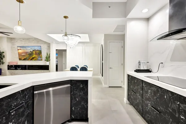 a kitchen with a sink and a refrigerator