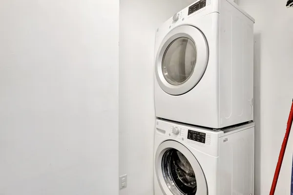 a view of a hallway with washer and dryer