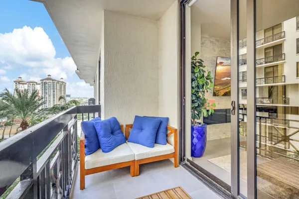 a view of balcony with furniture
