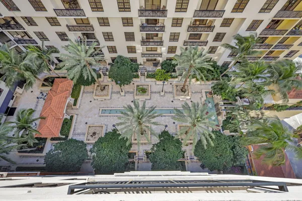 a view of a swimming pool with a yard