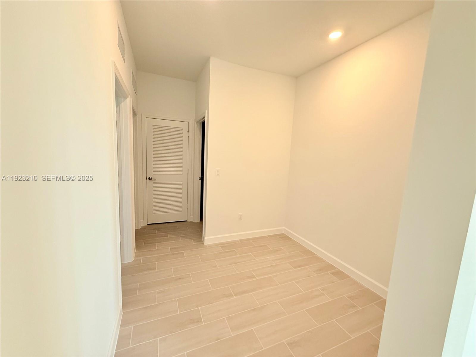 19600 Whispering Creek Road, Unit 19600 West Palm Beach, FL 33470 - Photo 12 of 26 a view of an empty room