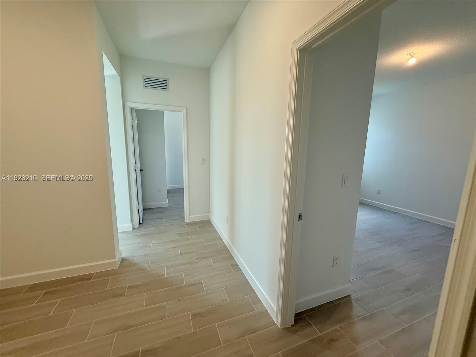 19600 Whispering Creek Road, Unit 19600 West Palm Beach, FL 33470 - Photo 14 of 26 a view of a hallway with a room