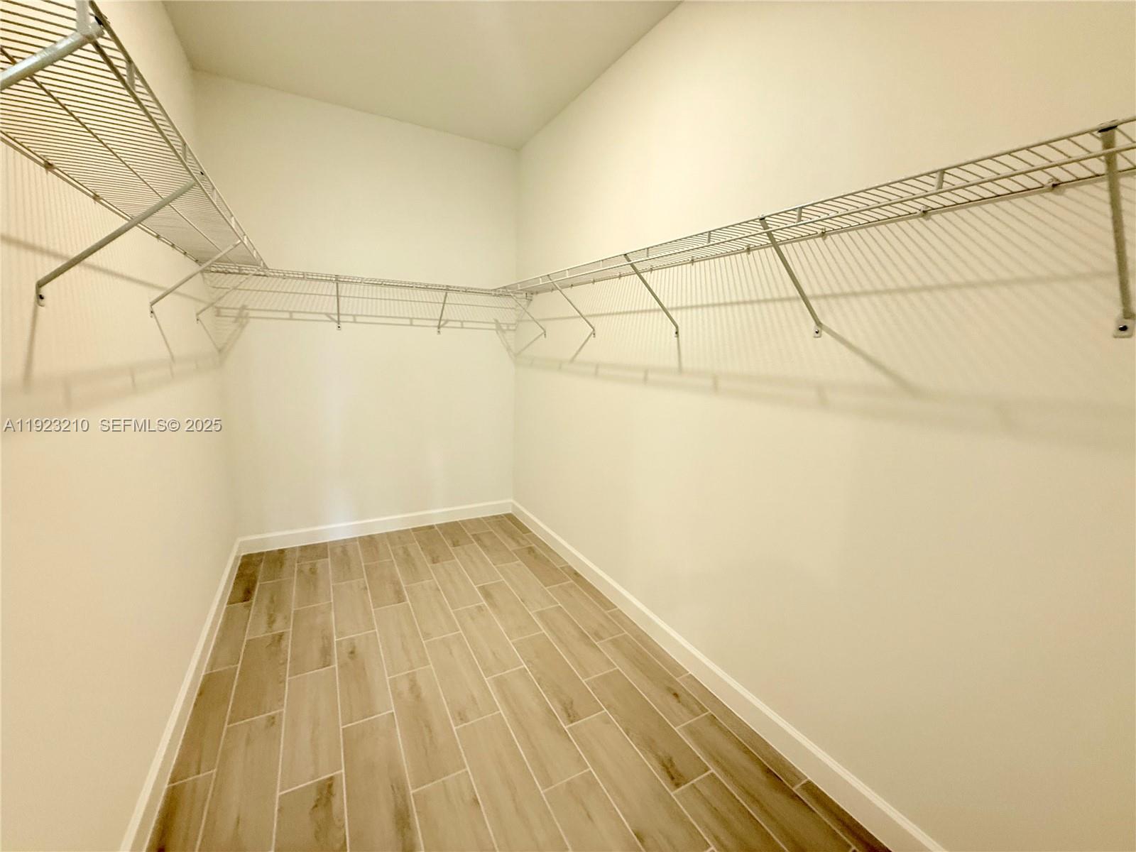 19600 Whispering Creek Road, Unit 19600 West Palm Beach, FL 33470 - Photo 7 of 26 a view of a room with wooden floor