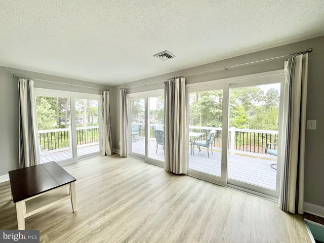 a kitchen with stainless steel appliances a refrigerator stove microwave and sink