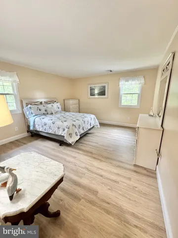 a view of a lake with chairs