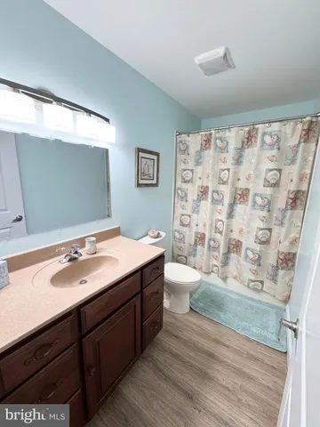 a view of a lake with boats and trees