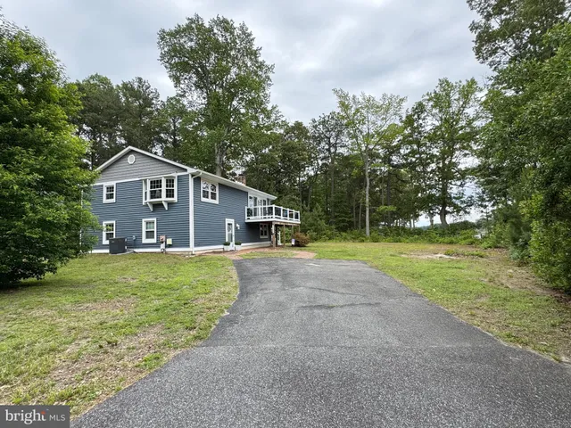 a view of swimming pool with outdoor seating and barbeque oven