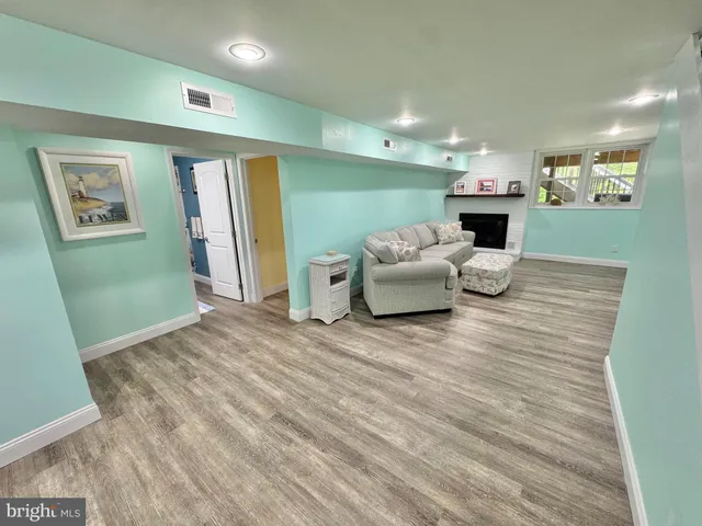 a bedroom with furniture and a wooden floor