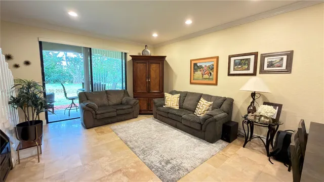 a kitchen with stainless steel appliances kitchen island granite countertop a sink and cabinets
