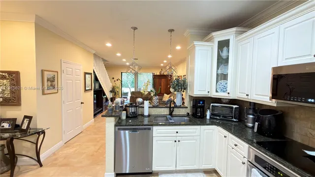 a living room with furniture a fireplace and wooden floor