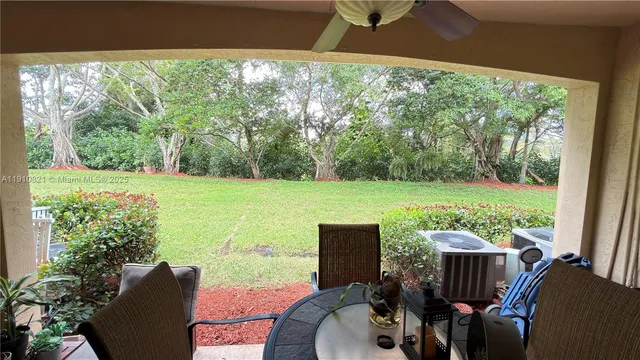 an aerial view of residential houses with outdoor space and street view