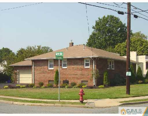 888 Hermann Road North Brunswick, NJ 08902 - Photo 1 of 10 a front view of a house with a garden