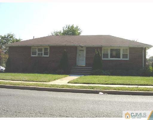 888 Hermann Road North Brunswick, NJ 08902 - Photo 2 of 10 a view of a house with a yard