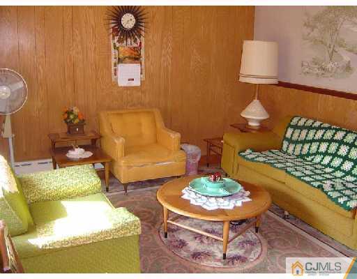 888 Hermann Road North Brunswick, NJ 08902 - Photo 7 of 10 a living room with furniture and a table