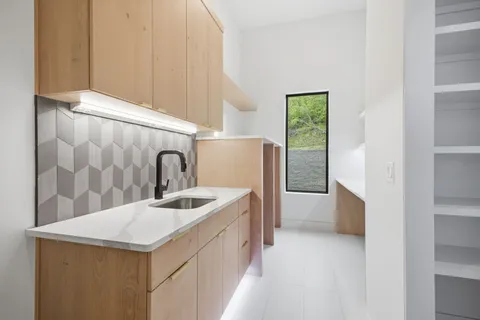 a kitchen with stainless steel appliances granite countertop a stove and a refrigerator