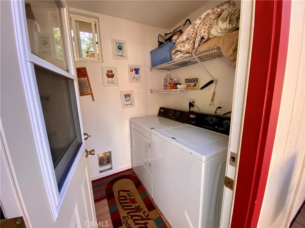 10787 Foothill Road Middletown, CA 95461 - Photo 16 of 23 a bedroom with a refrigerator and a window