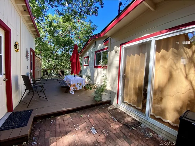 a backyard of a house with outdoor seating