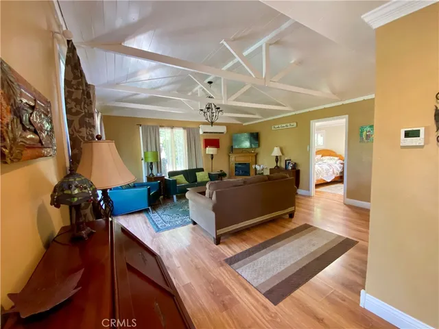 a living room with furniture and a mirror