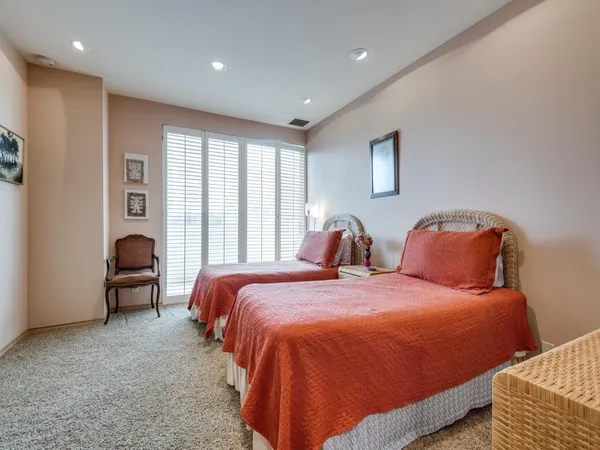a bedroom with bed and window