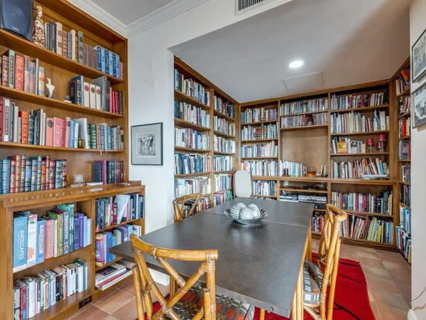 a view of a workspace with bookshelf