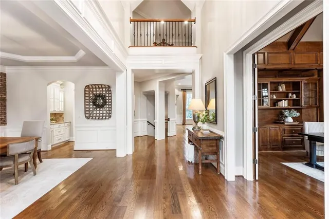 a view of a livingroom with furniture wooden floor and a rug