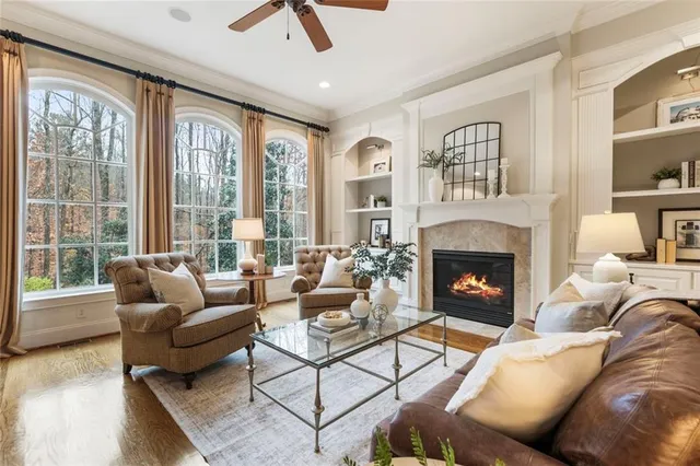 a living room with furniture and a fireplace