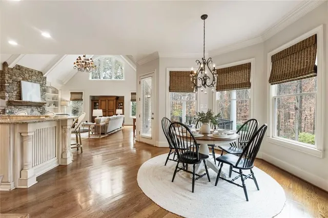 a view of a dining room with furniture window and wooden floor