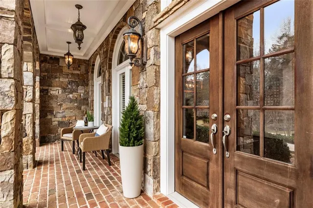 a view of a balcony with chairs