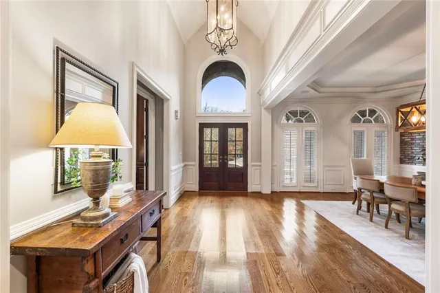 a view of a livingroom with furniture window and wooden floor