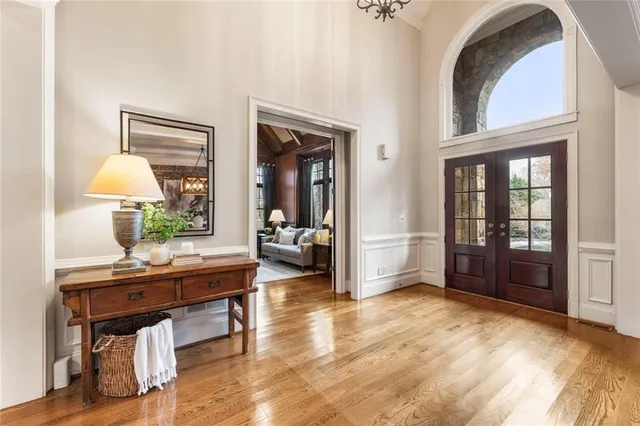 a living room with furniture a window and a table