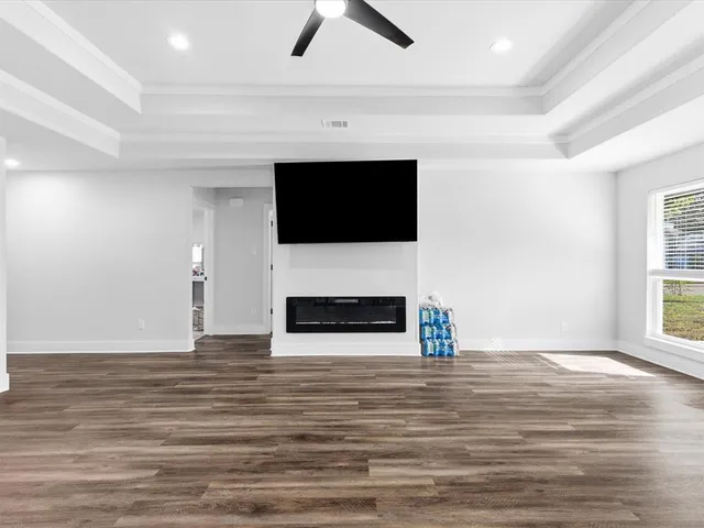 a view of living room with furniture and a flat screen tv