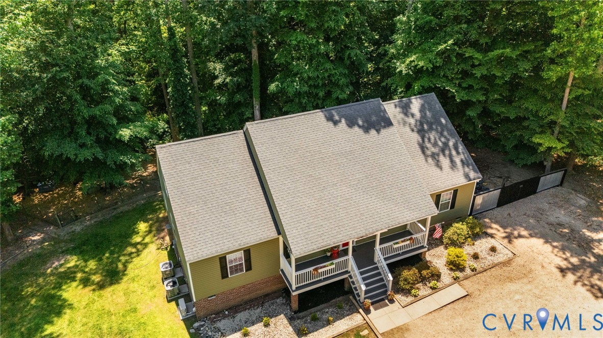 1755 Dispatch Road Quinton, VA 23141 - Photo 77 of 86 an aerial view of a house with swimming pool and large trees