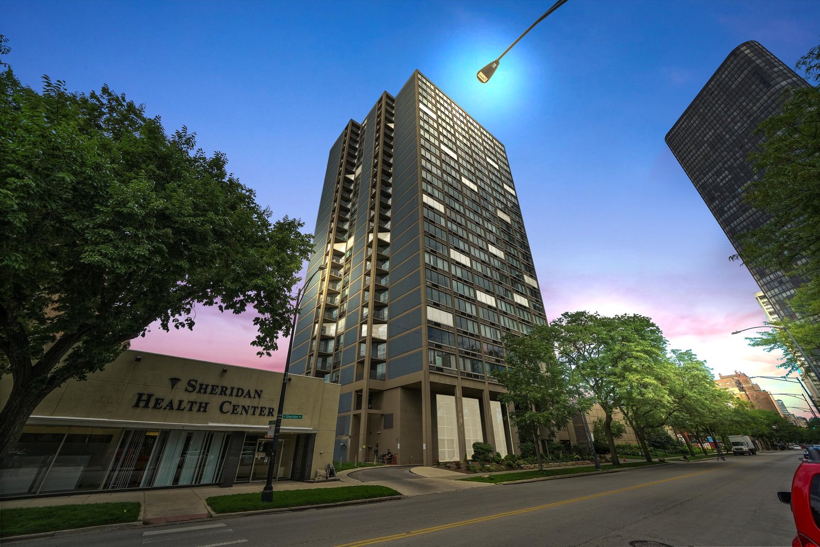 a view of a large building next to a road