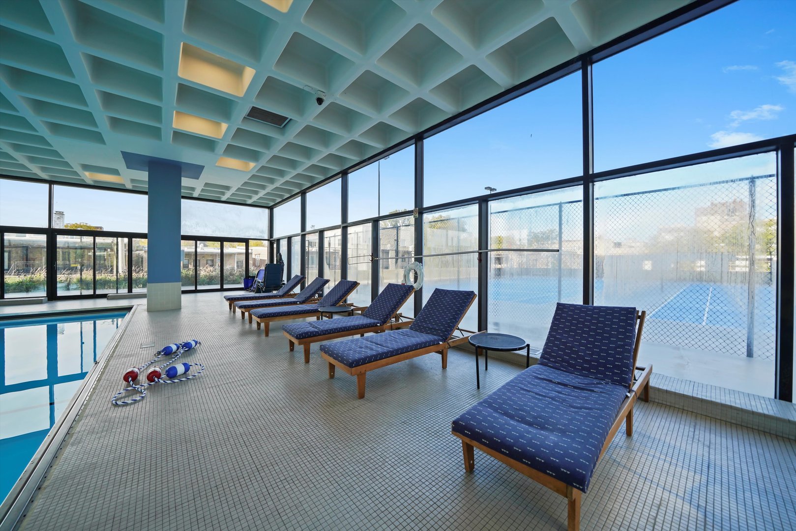 5320 North Sheridan Road, Unit 2304 Chicago, IL 60640 - Photo 25 of 28 a living room with furniture and a floor to ceiling window