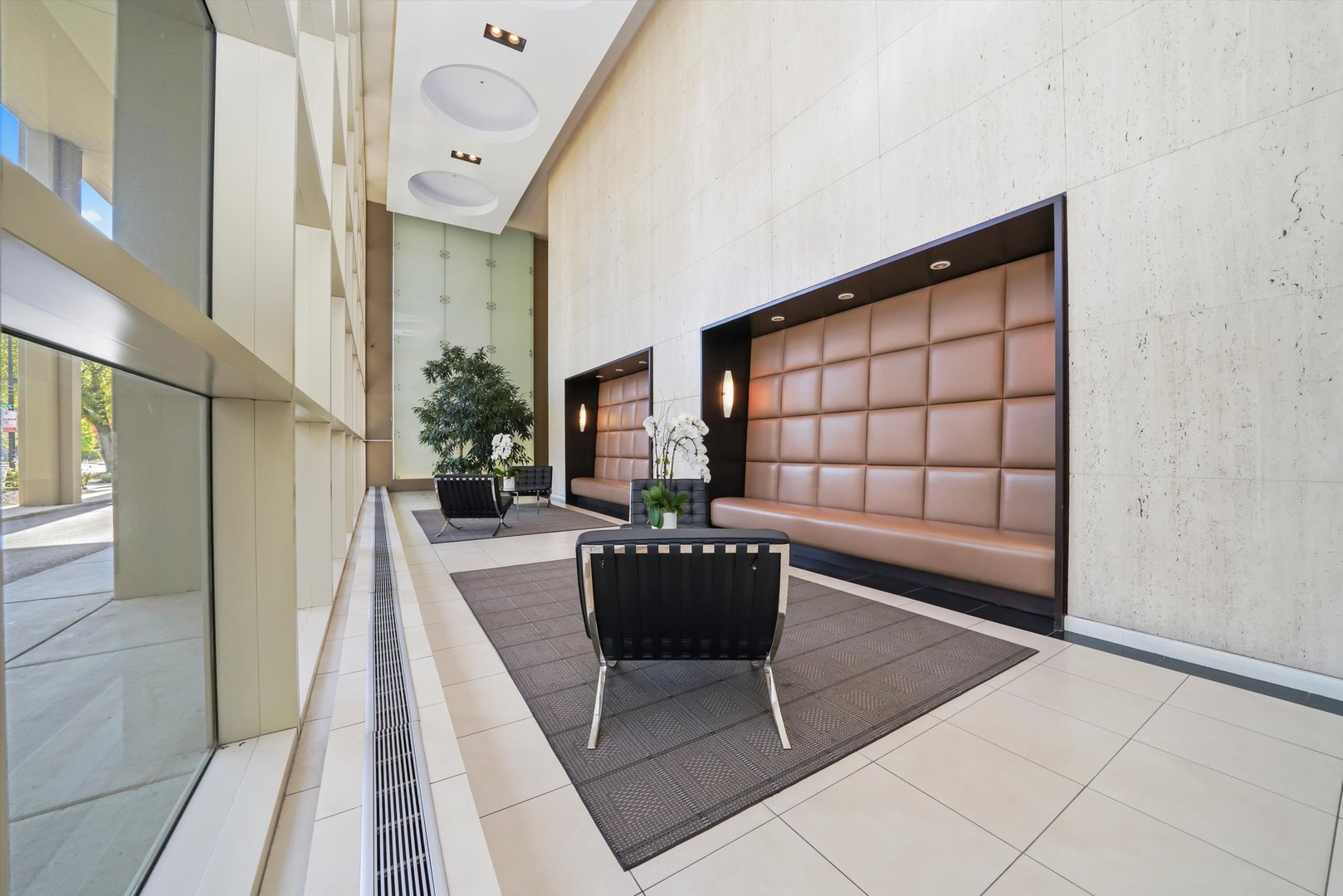 5320 North Sheridan Road, Unit 2304 Chicago, IL 60640 - Photo 28 of 28 a living room with a couch and a table