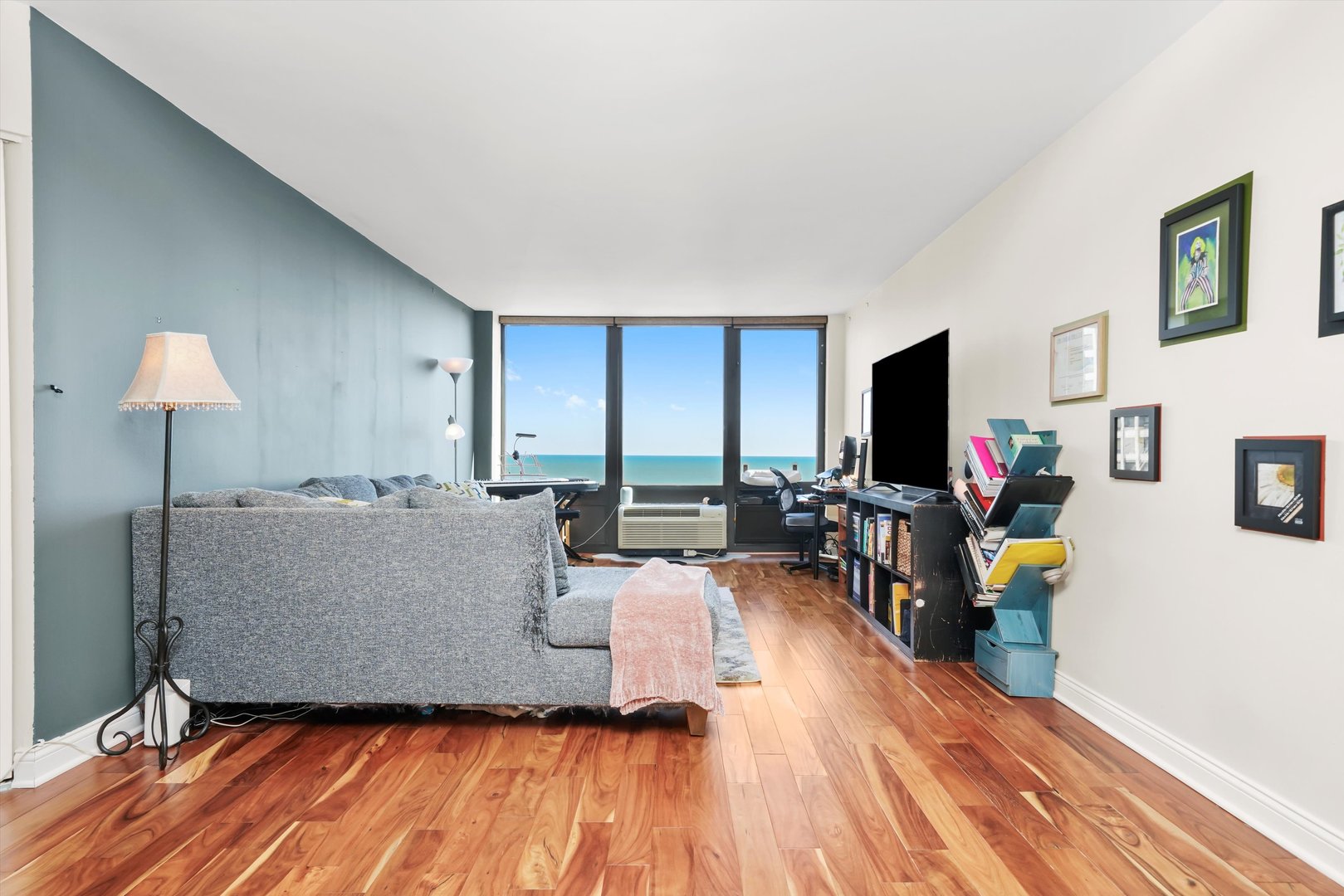 5320 North Sheridan Road, Unit 2304 Chicago, IL 60640 - Photo 3 of 28 a living room with furniture and a flat screen tv