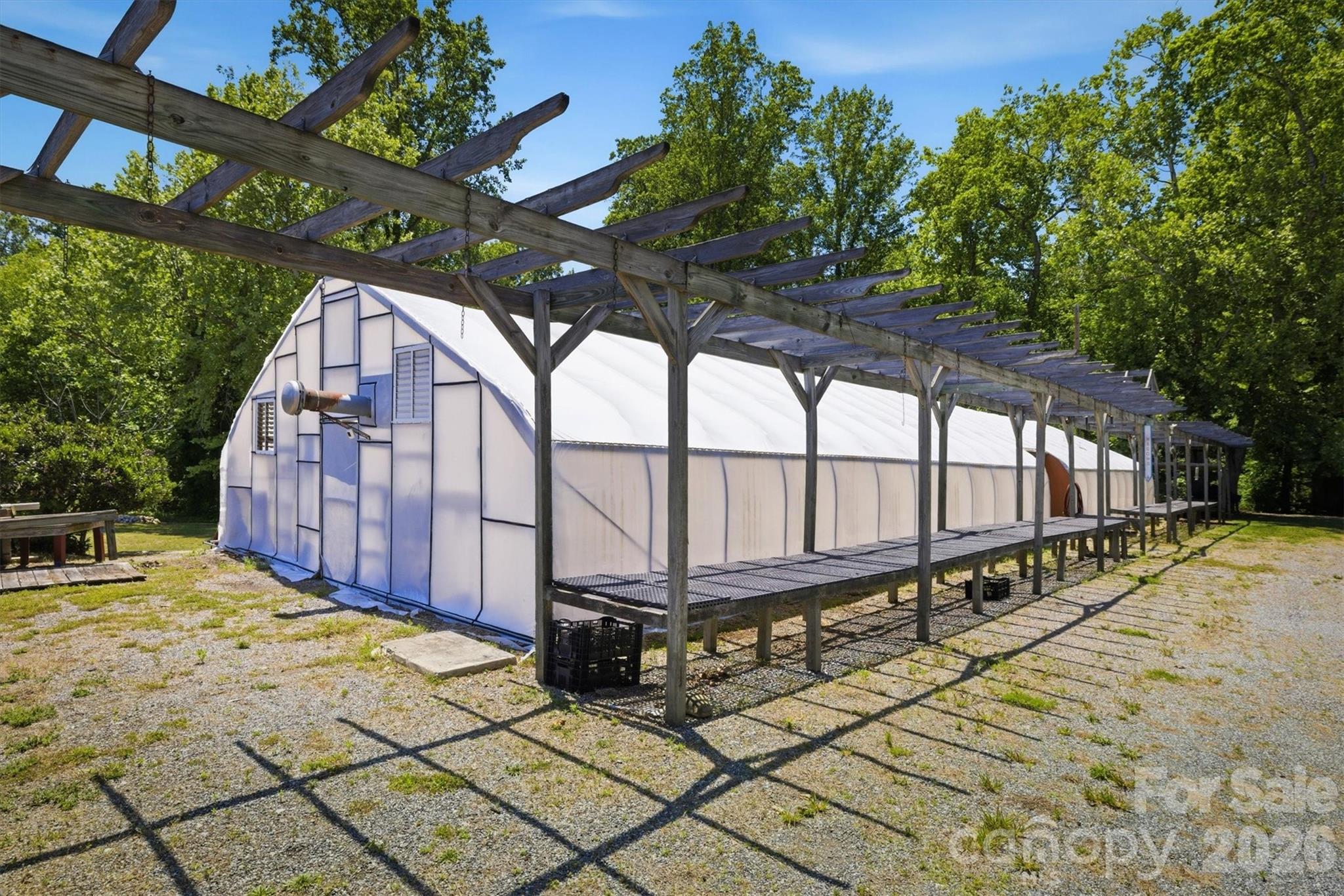 905 Carbon City Road Morganton, NC 28655 - Photo 24 of 29 a view of a backyard with a small cabin