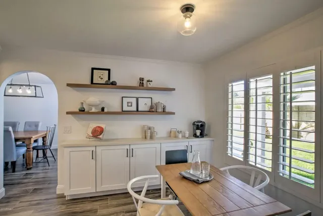 a kitchen with a refrigerator and a sink