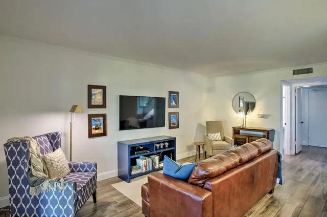 a living room with furniture and a large window