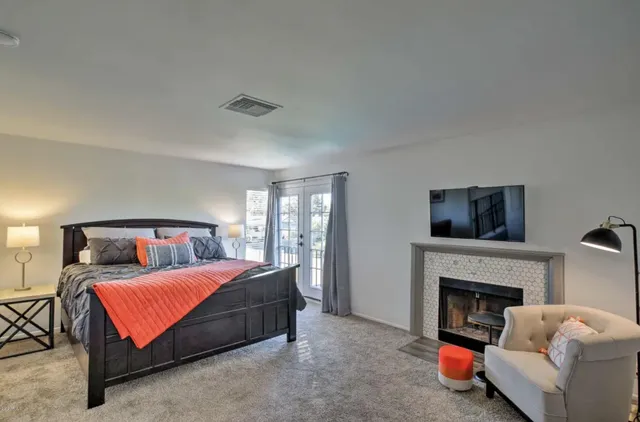 a bedroom with furniture and baby crib