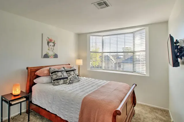 a dining room with furniture and a garden
