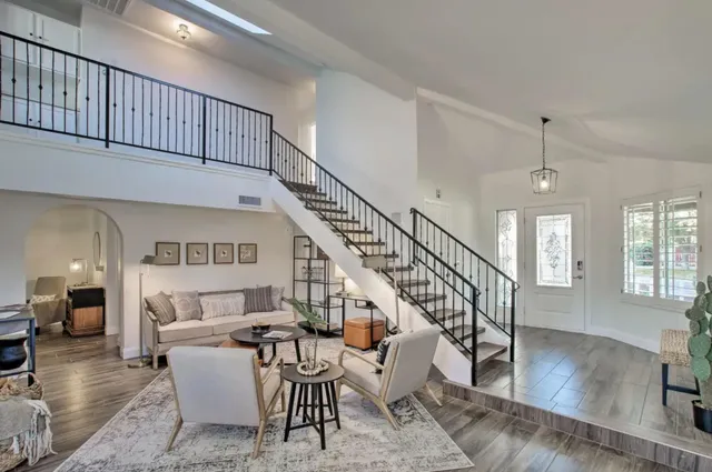 a living room with furniture or stairs and a couch
